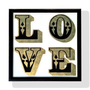 Vintage love sign with 22ct gold leaf on white background in gloss black frame